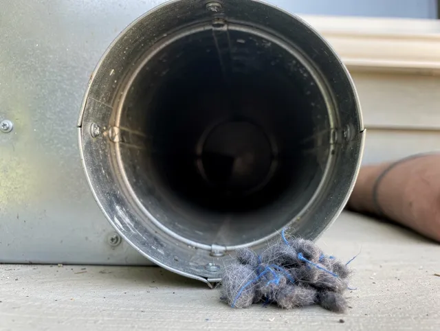 Diamond Bar Dryer Vent Cleaning technician using specialized equipment to clear severe dryer vent blockage in Diamond Bar